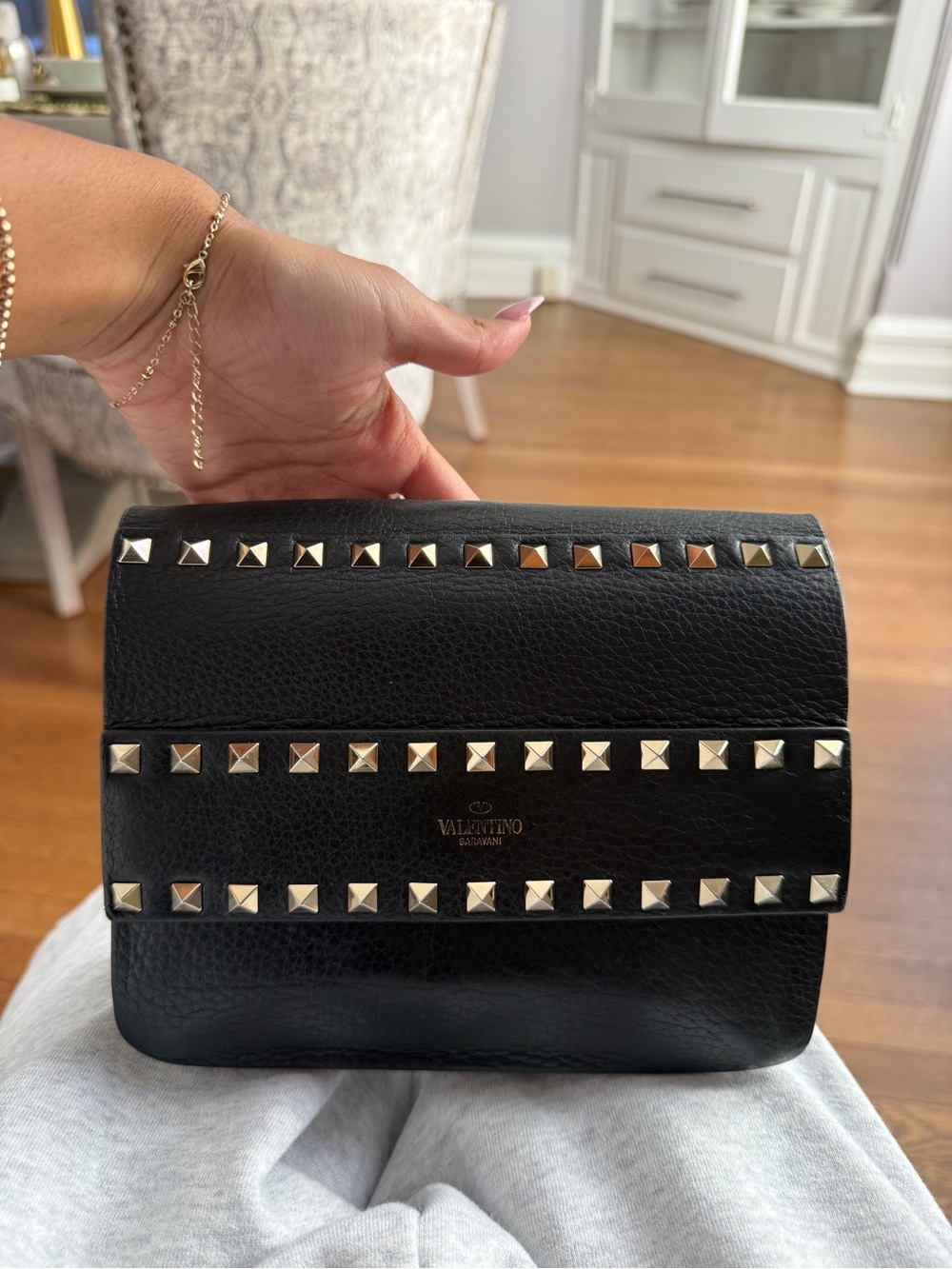 Valentino Garavani Black Leather Rockstud Wristlet Clutch with Gold Studs